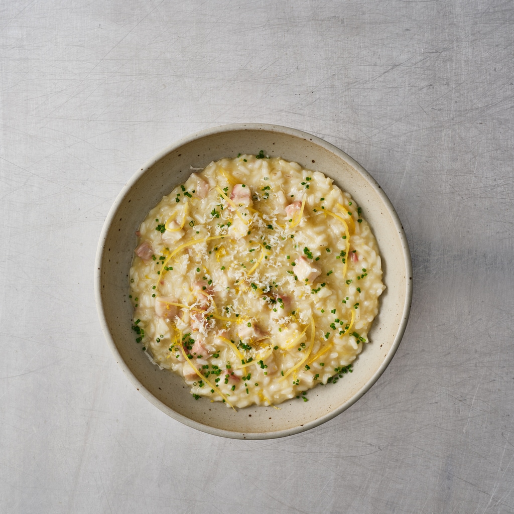 Cremiges Risotto mit geräuchertem Aal und eingelegter Salzzitrone.